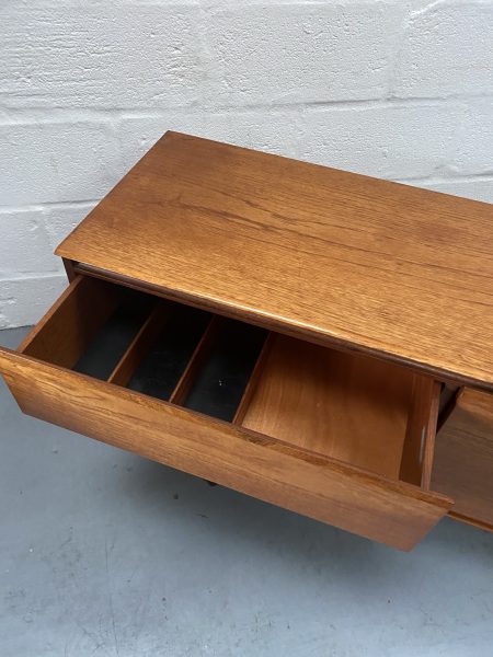 A fantastic linear teak sideboard designed by Philip Hussey for White & Newton of Portsmouth, circa 1967.